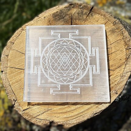 Front view of Shree Yantra engraved Selenite charging plate on wooden block